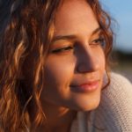 Beautiful,Curly,Girl,Is,Smiling.,Outdoor,Shoot,,Sunset